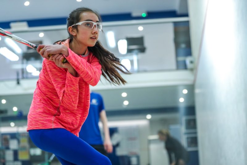 Girl playing squash